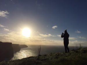 Atlas student at Cliffs of Moher standing on the edfe of the cliff