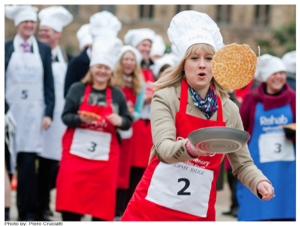 Pancake Tuesday - woman race with the pancakes