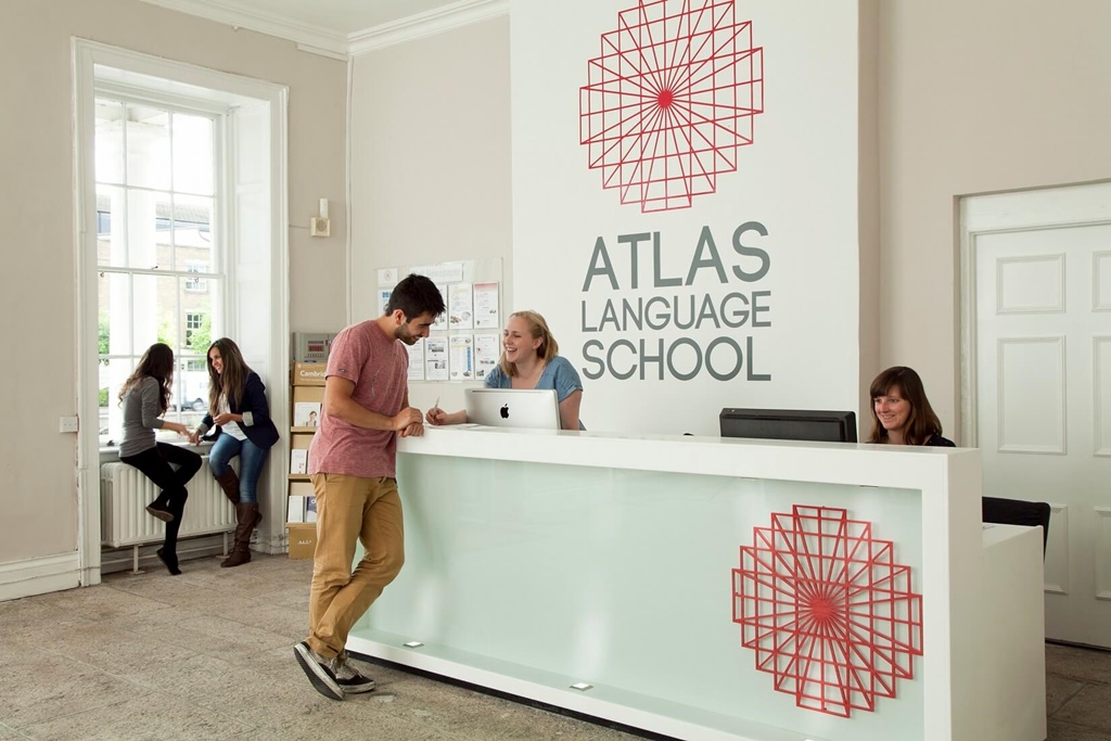 Atlas Langauge School receptionits and students help
