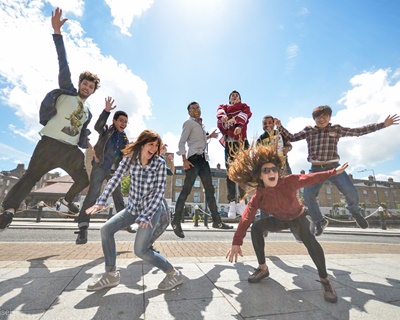 Group of students jamping in a sunny day