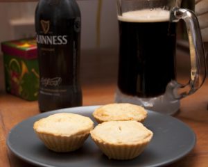 A pint of Guinness and some traditional mince pies