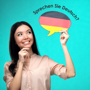 Image of a person holding a German flag with a speech bubble saying “Do you speak German?” in German.