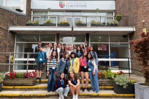 Students from Atlas Junior Chichester in front of the campus