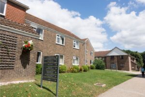 Exterior view of the residential accommodation facilities at Atlas Junior Chichester on campus.