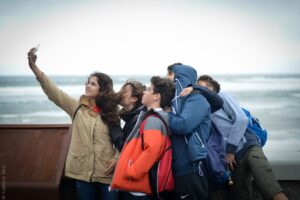 Students taking selfie at Lehinch Beach as part of the Atlas Junior Clare programme.