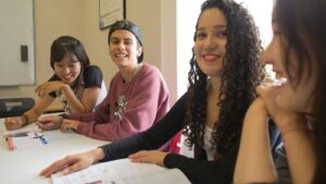 Students actively engaged in a General English class, learning and empowering themselves through language education - General English Courses