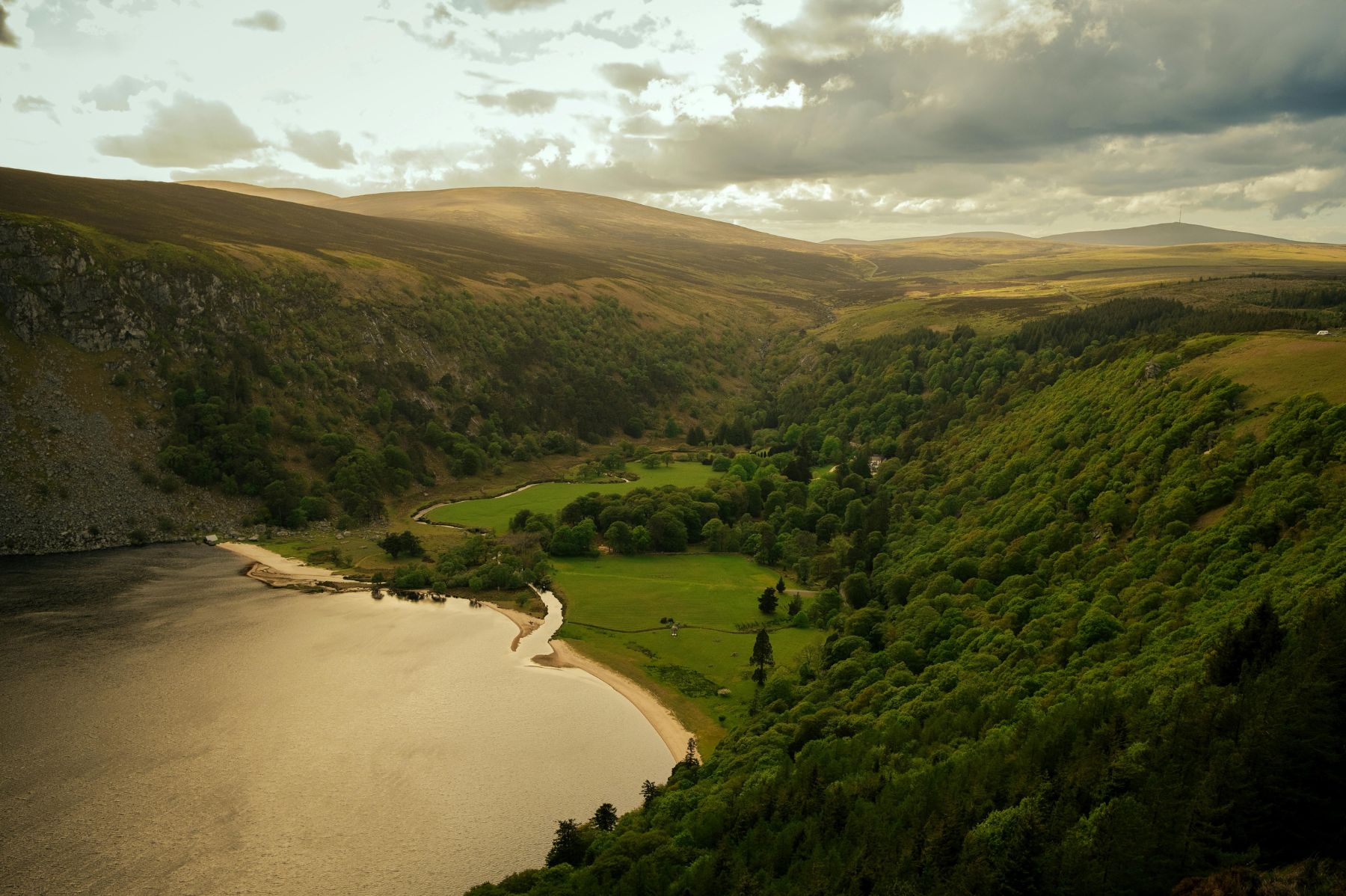 Scenic view of Wicklow, Ireland, with lush green hills, rolling countryside, and vibrant greenery, representing the Emerald Isle.