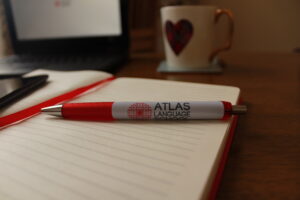 Atlas language school pen and notebook