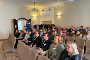 Attendees at the Atlas Language School Erasmus+ event in Wroclaw listen attentively during an information session on mobility opportunities in Dublin and Malta.