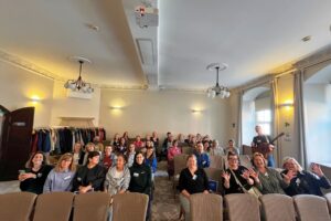 Group photo of participants at the Erasmus+ event in Wroclaw, hosted by Atlas Language School, featuring a warm atmosphere, smiles, and Irish cultural touches.