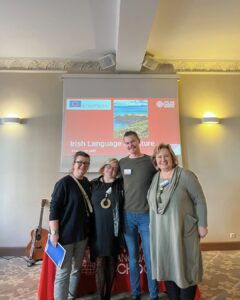 Group photo of Erasmus+ event attendees with Ciarán Lynch from Atlas Language School, celebrating a successful Irish language and culture session in Wroclaw.