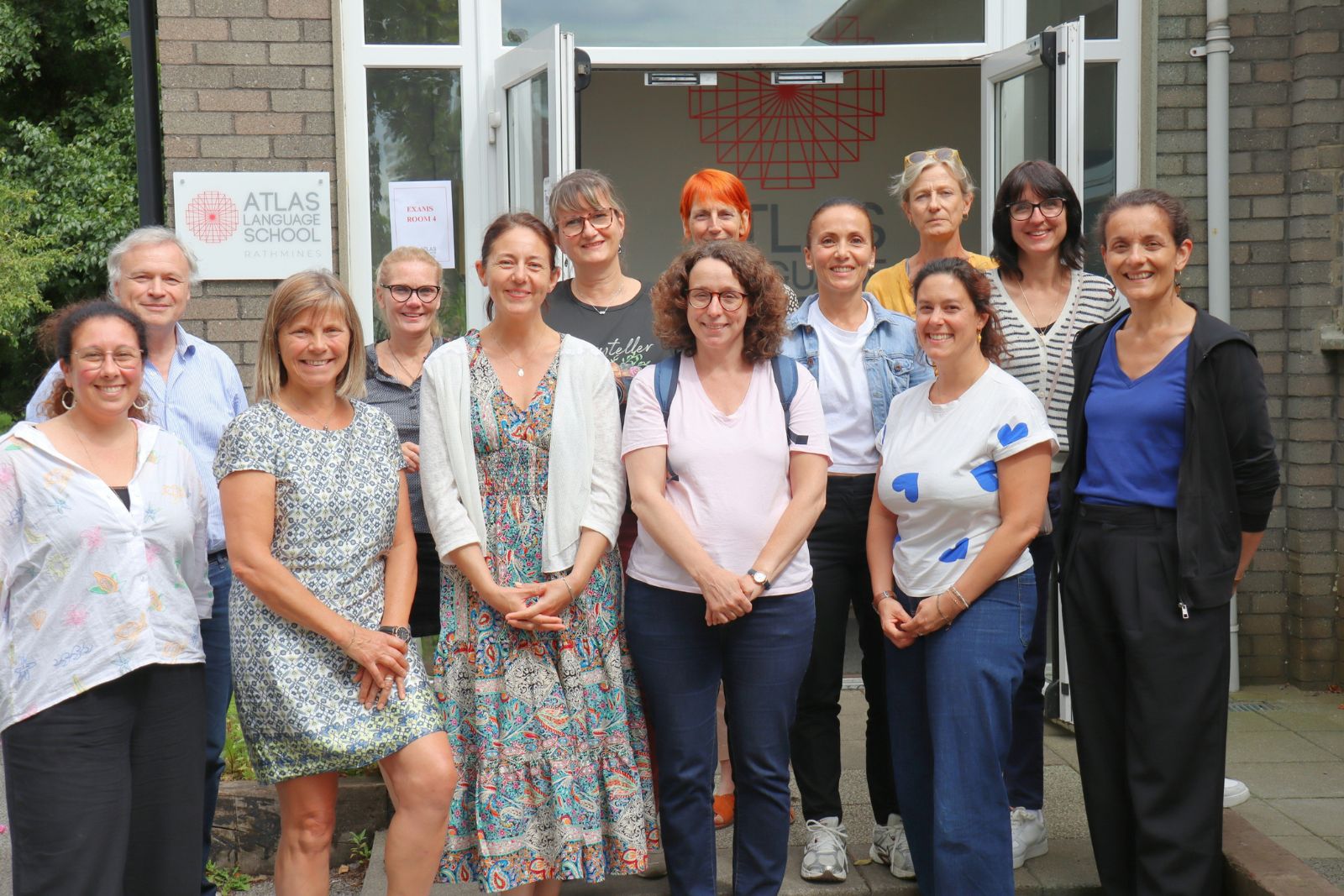 Erasmus+ General English & Sustainability in Education – Adult Participants Smiling Together in Front of Rathmines Centre