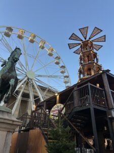 Christmas market in Liverpool with a carousel and a festive Ferris wheel