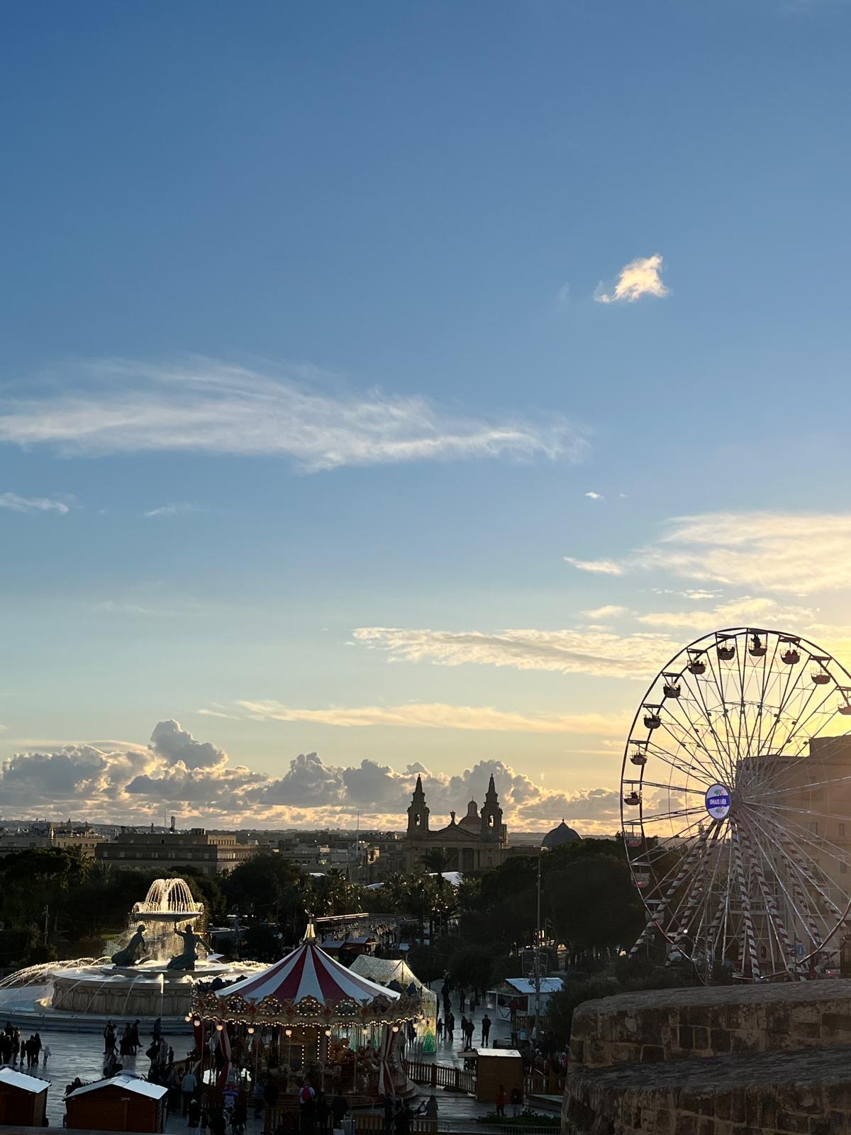 Aerial view of Valletta Christmas market with a festive Ferris wheel