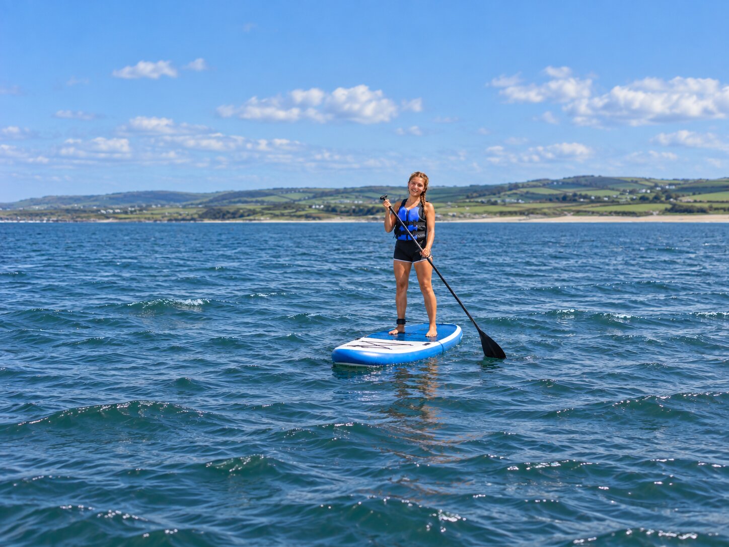Atlas Junior Clare student on a stand-up paddleboard